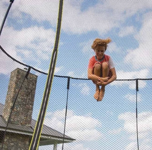 Tuck jump on a Springfree Trampoline