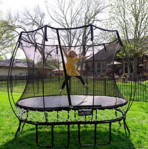 Kid with jumping on a trampoline