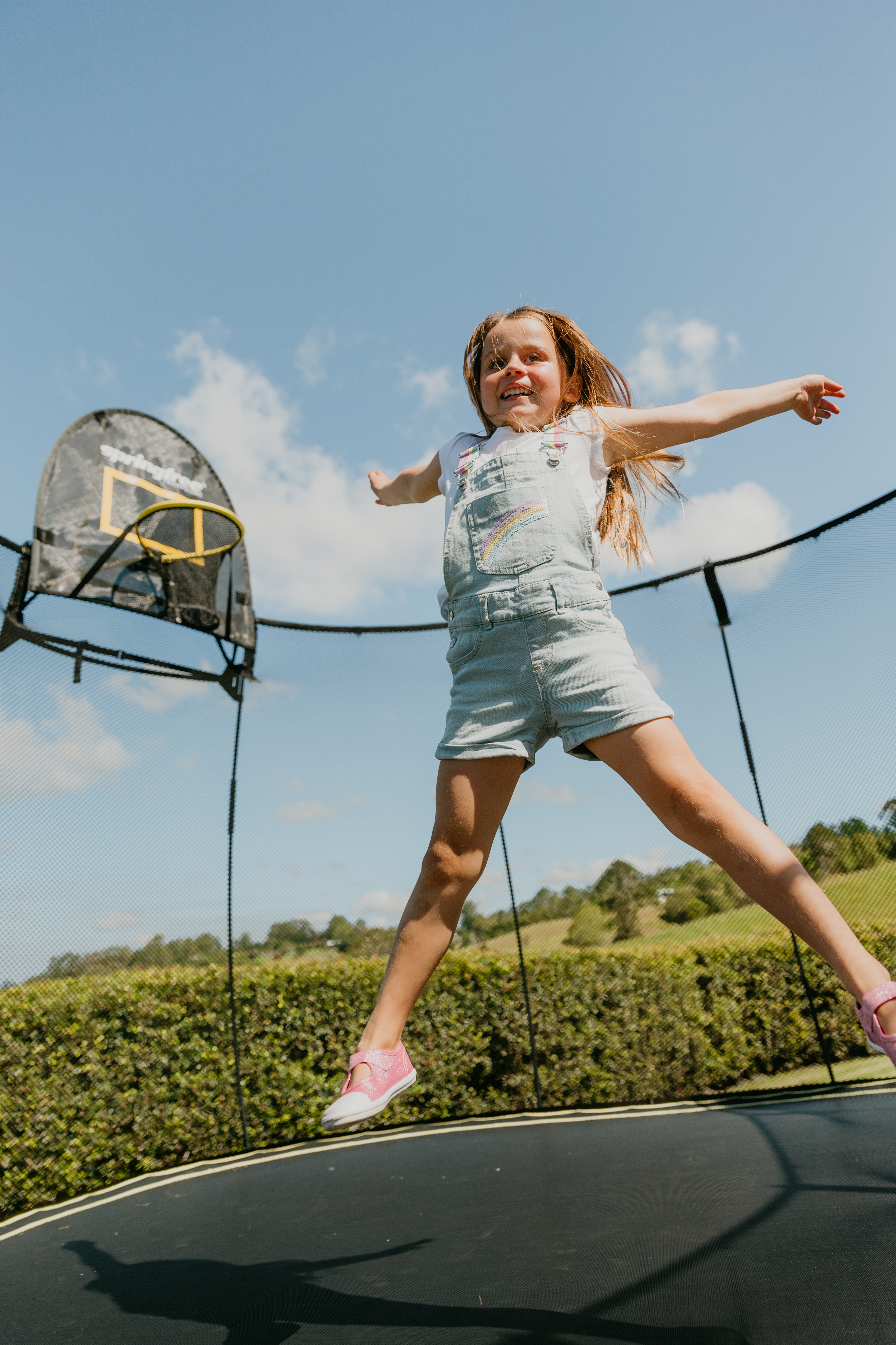 Girl bouncing on Springfree Trampoline